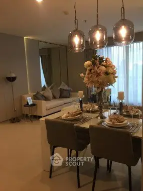 Luxurious dining and living area with elegant decor and ambient lighting