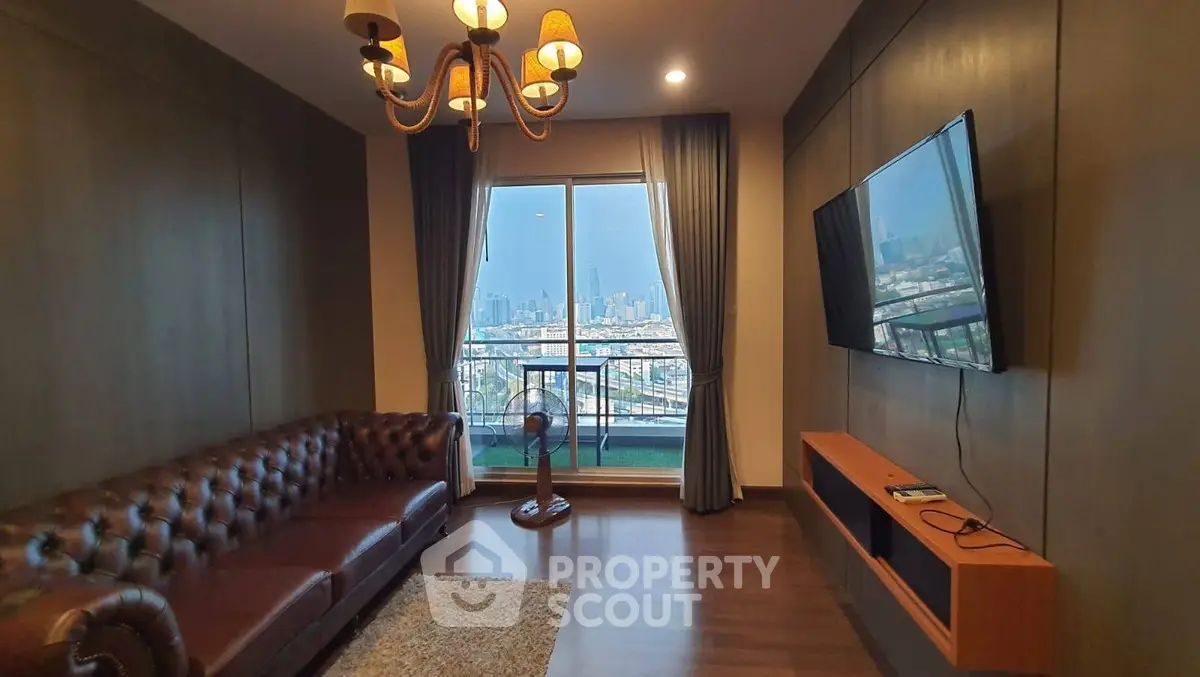 Luxurious living room with city view, elegant chandelier, and modern decor in high-rise apartment.