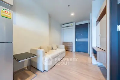 Modern living room with sleek design and cozy sofa in a stylish apartment.