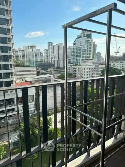 Stunning cityscape view from a modern balcony in a high-rise building.