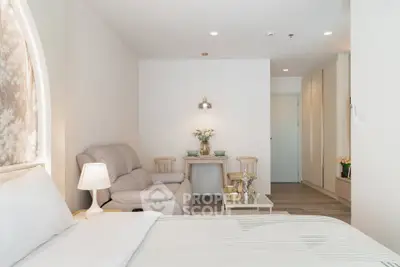 Modern studio apartment with cozy living area and elegant decor