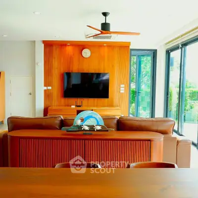 Luxurious living room with leather sofas and modern decor