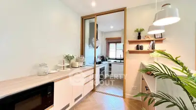 Modern kitchen with sleek design, featuring open layout and stylish decor.