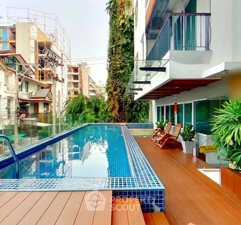 Luxurious apartment with rooftop pool and modern design in vibrant urban setting.