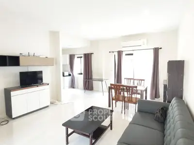 Spacious modern living room with sleek furniture and natural light