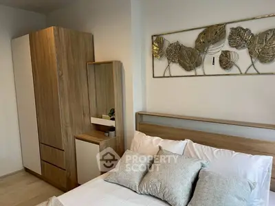 Modern bedroom with stylish wooden furniture and elegant wall art