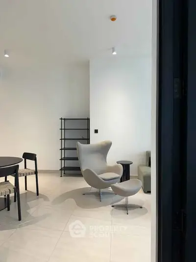 Modern living room with stylish chair and minimalist decor