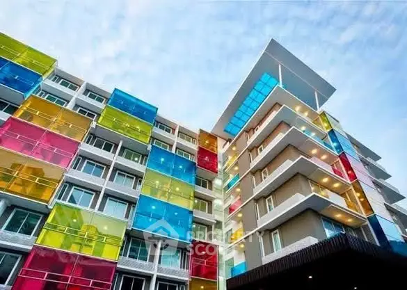 Vibrant modern apartment building with colorful balconies and unique architecture.