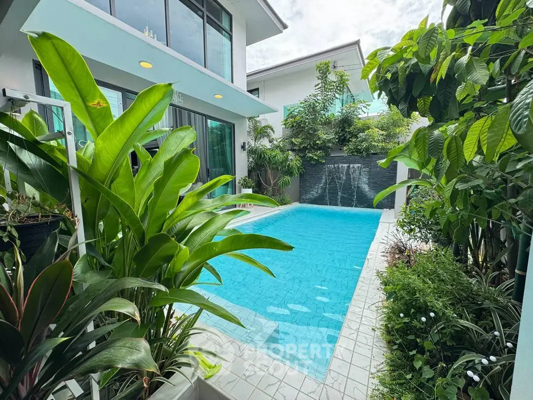 Luxurious private pool with lush greenery in modern home exterior