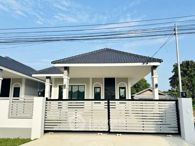 Charming single-story home with modern design and gated entrance