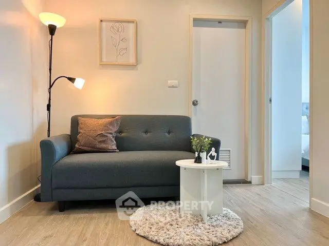 Cozy living room with modern sofa and stylish decor in a bright apartment.