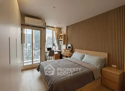 Modern bedroom with city view, featuring sleek design and ample natural light.