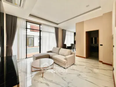Luxurious modern living room with elegant marble flooring and stylish furniture