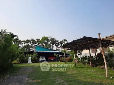 Charming rural property with lush greenery and spacious outdoor area, perfect for nature lovers.
