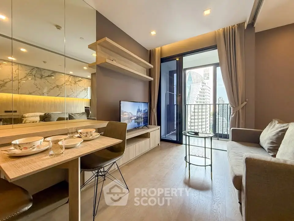 Modern living room with city view, stylish decor, and open balcony access.