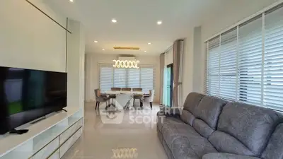 Spacious modern living room with elegant dining area and large windows