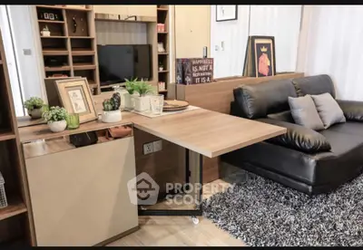 Modern living room with sleek black sofa and stylish decor