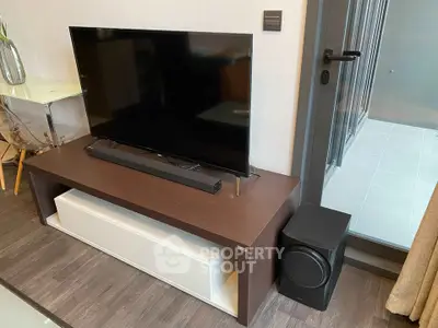 Modern living room with sleek TV setup and stylish furniture