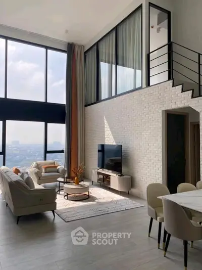 Stunning modern living room with high ceilings and large windows offering breathtaking city views.