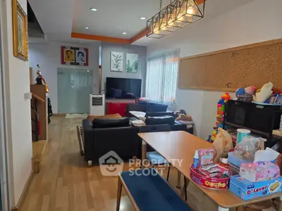 Spacious living room with modern decor and ample natural light