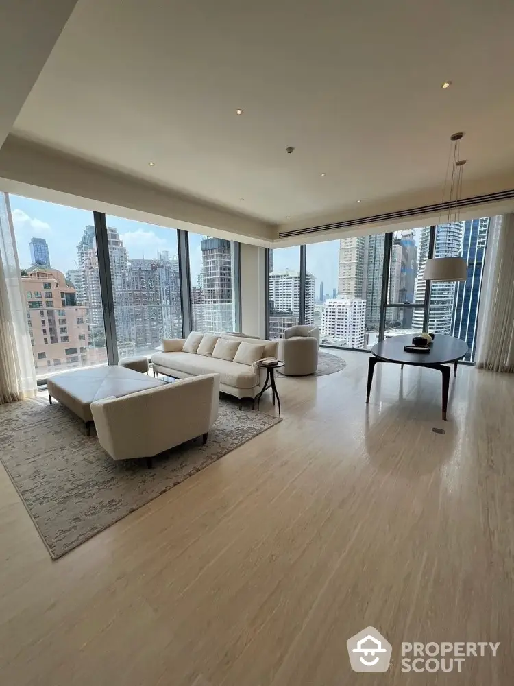 Luxurious corner unit living room with panoramic city views and elegant furnishings.