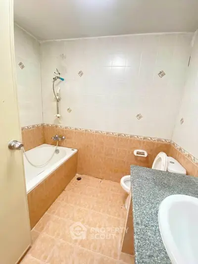 Cozy bathroom with bathtub and modern fixtures in a real estate property.