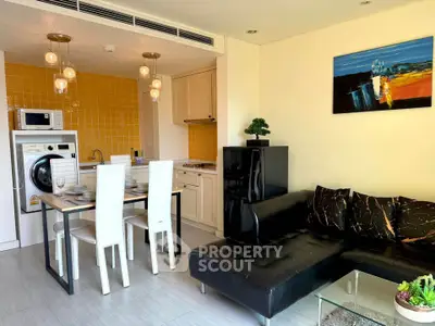 Modern open-plan kitchen and living room with stylish decor and appliances