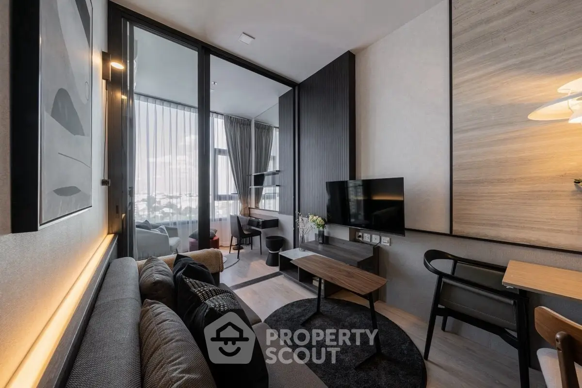 Modern living room with stylish decor and city view, featuring sleek furniture and ambient lighting.
