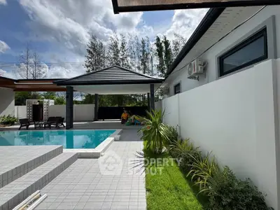 Luxurious modern home with private pool and lush garden, perfect for relaxation and entertaining.
