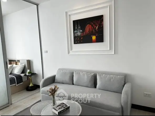 Modern living room with stylish decor and cozy sofa in a contemporary apartment.