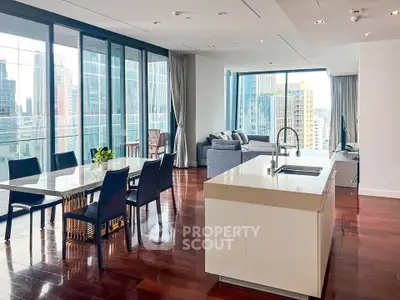 Luxurious open-plan living room with stunning city views and modern kitchen.