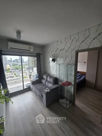 Modern living room with balcony view in urban apartment