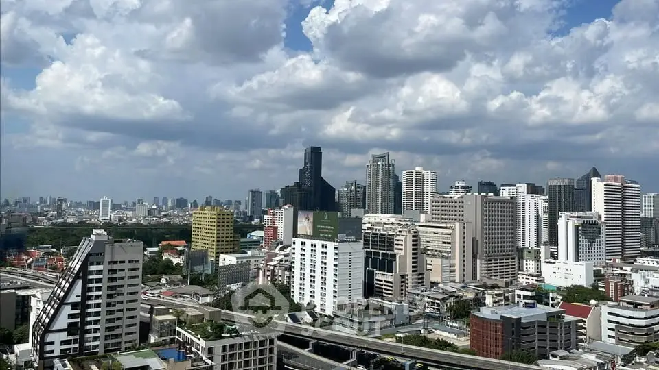Stunning city skyline view with modern skyscrapers under a vibrant cloudy sky.