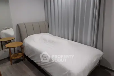 Cozy bedroom with modern decor and comfortable bed in a stylish apartment.