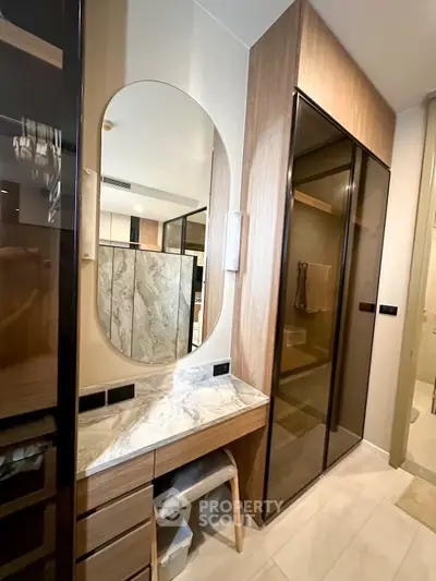 Modern bathroom with elegant marble countertop and sleek wooden cabinetry