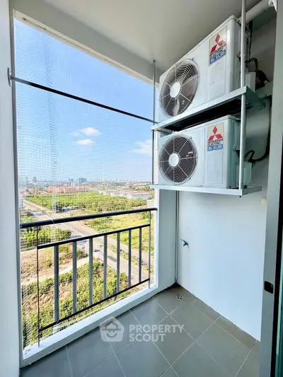High-rise balcony with air conditioning units and panoramic city view