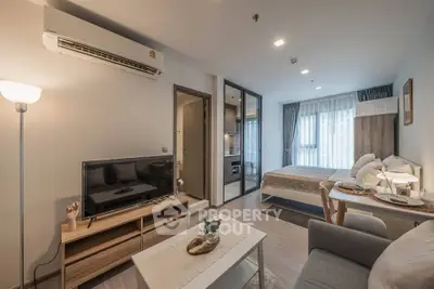 Modern studio apartment with cozy living area and stylish bedroom