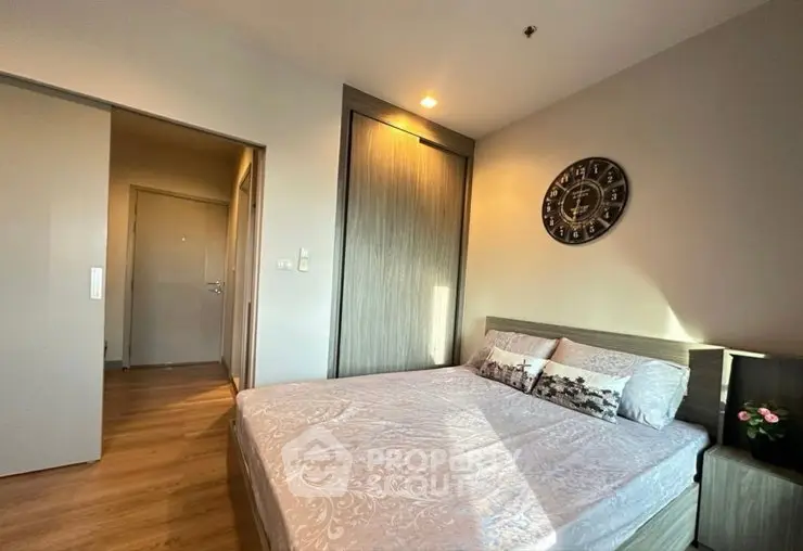 Cozy bedroom with modern decor and ample natural light