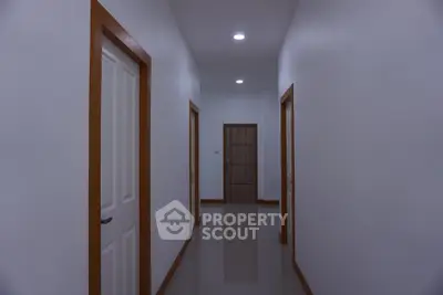 Spacious hallway with modern design and multiple doors