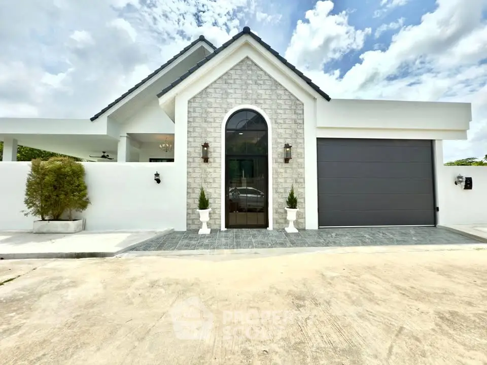 Stunning modern house exterior with elegant stone facade and sleek garage door.