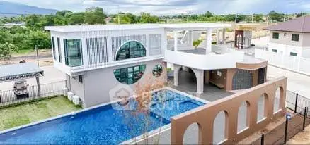 Modern luxury home with stunning pool and unique architectural design.