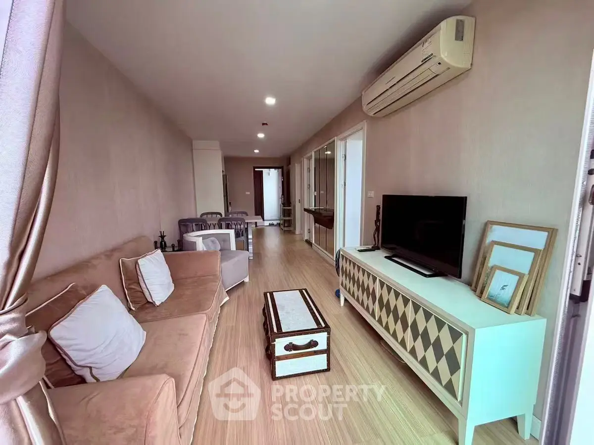 Spacious living room with modern decor and air conditioning