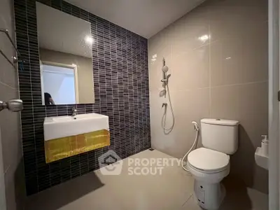 Modern bathroom with sleek tiles and contemporary fixtures