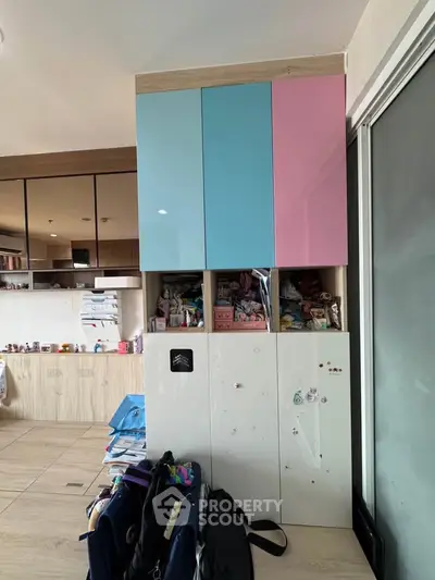 Modern kitchen with colorful cabinets and ample storage space