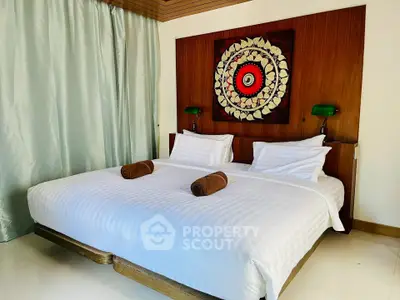 Luxurious bedroom with elegant decor and cozy bedding in a modern real estate property.