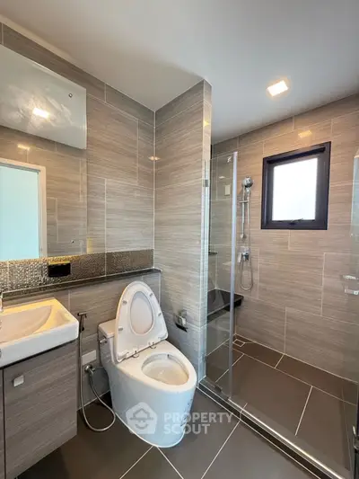 Modern bathroom with sleek design and glass shower enclosure