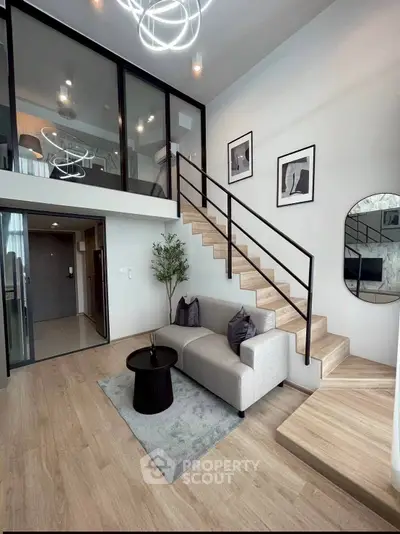 Modern duplex living room with stylish staircase and elegant decor