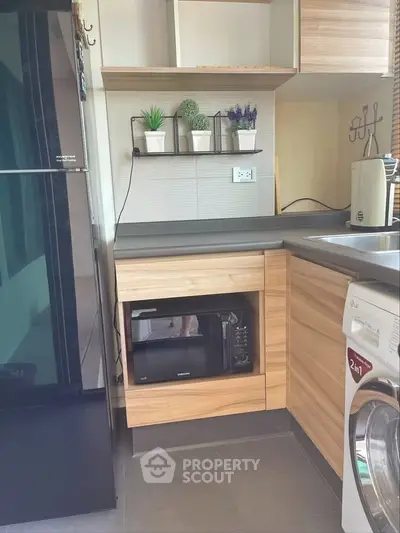 Modern kitchen with sleek appliances and stylish cabinetry