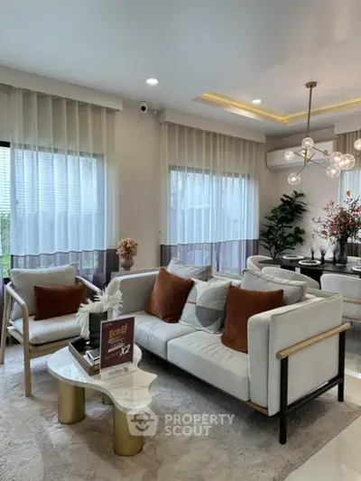 Modern living room with stylish decor and elegant lighting