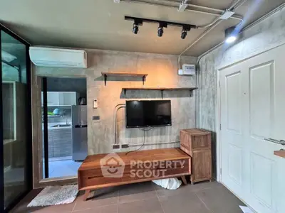 Modern living room with stylish wooden furniture and wall-mounted TV